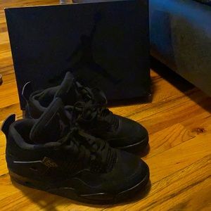 Black on black Jordan 4